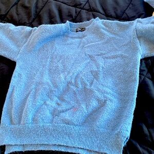 its a blue sweater a small red paint stain on the front though